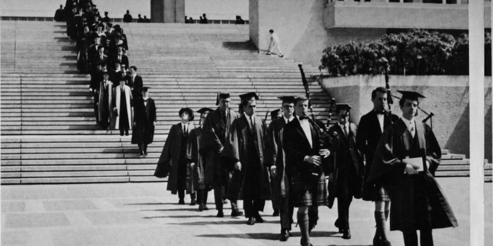 First graduates of SFU descending the stairs